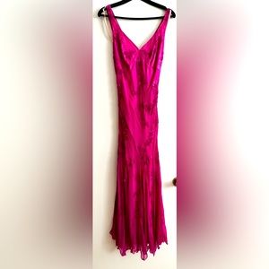 Vibrant purple-pink floor length dress that may be worn for a special occasion